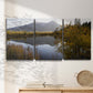 Three-panel canvas wall art featuring low light river photography, displayed in a minimalist living room above a console table.