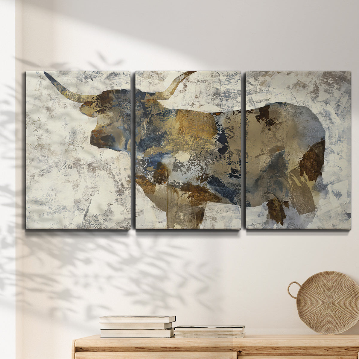 Three-panel canvas wall art featuring farm animal portrait in rustic setting, displayed in a minimalist living room above a console table.