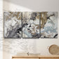 Three-panel canvas wall art featuring marbled modern abstract textures, displayed in a minimalist living room above a console table.