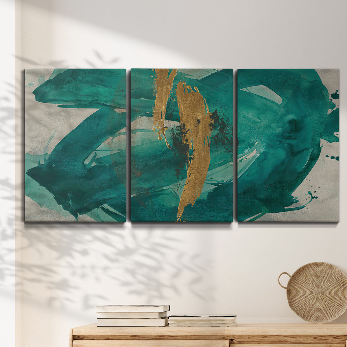 Three-panel canvas wall art featuring interconnected abstract flowing forms, displayed in a minimalist living room above a console table.