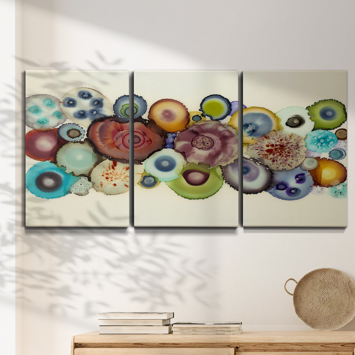 Three-panel canvas wall art featuring mid century geometric red pathway, displayed in a minimalist living room above a console table.