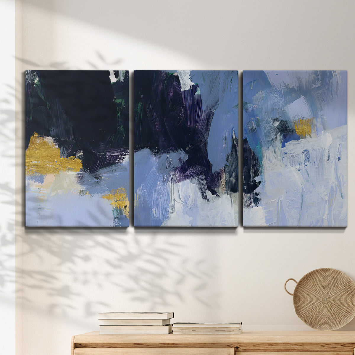 Three-panel canvas wall art featuring icy abstract arctic ledge, displayed in a minimalist living room above a console table.
