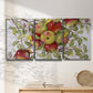 Three-panel canvas wall art featuring apples hanging from branch, displayed in a minimalist living room above a console table.