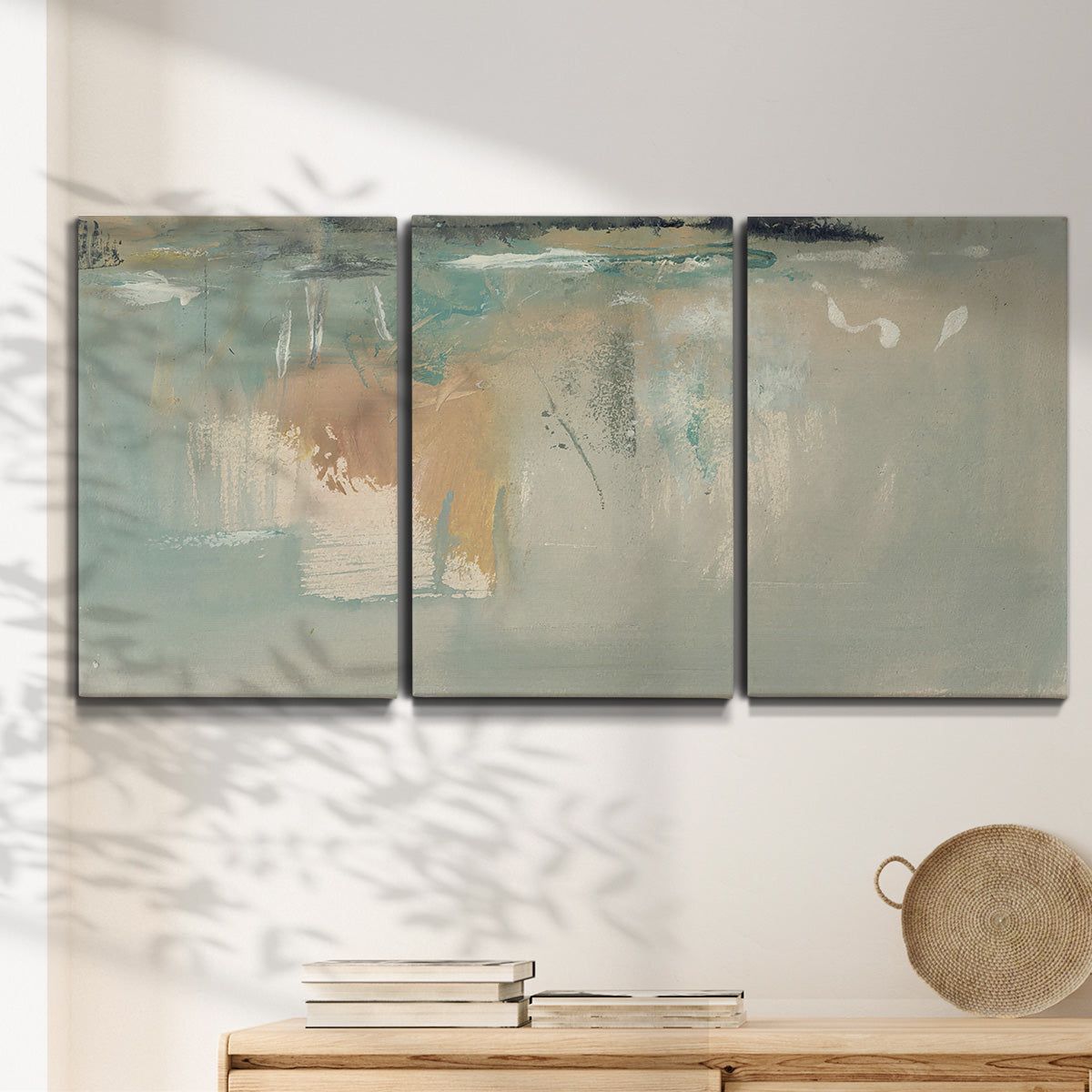 Three-panel canvas wall art featuring minimalist abstract emotional fields, displayed in a minimalist living room above a console table.