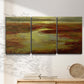 Three-panel canvas wall art featuring coastal shoreline with warm light, displayed in a minimalist living room above a console table.
