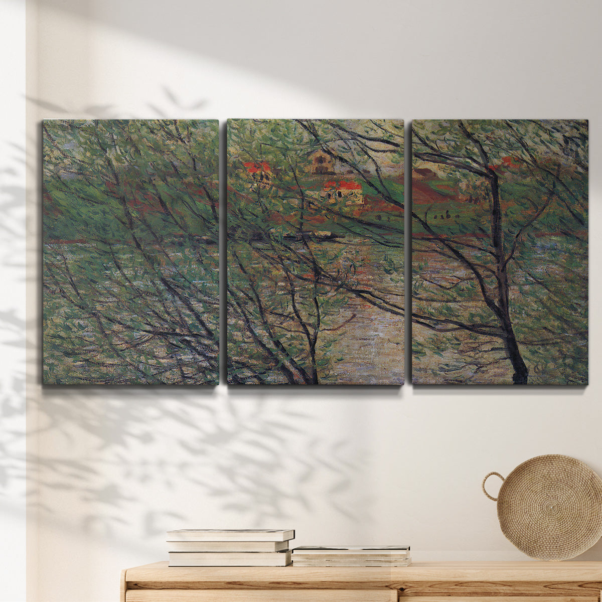 Three-panel canvas wall art featuring spring countryside with fresh foliage, displayed in a minimalist living room above a console table.