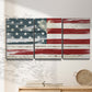 Three-panel canvas wall art featuring rustic american flag country style, displayed in a minimalist living room above a console table.