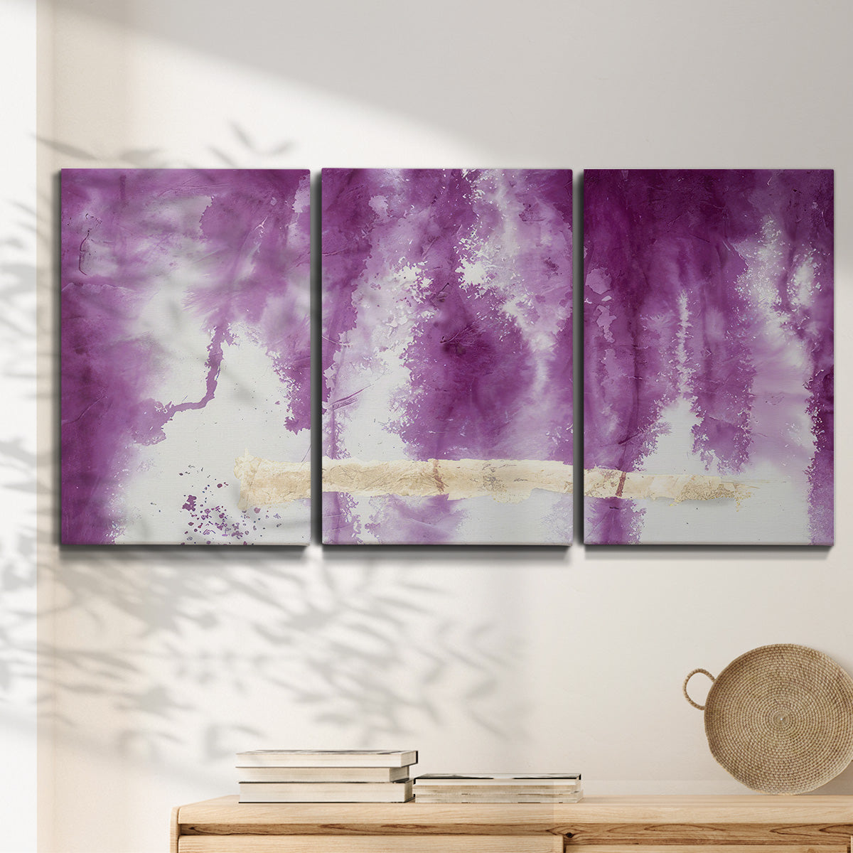 Three-panel canvas wall art featuring saturated abstract color fields, displayed in a minimalist living room above a console table.