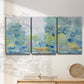 Three-panel canvas wall art featuring quiet abstract morning landscape, displayed in a minimalist living room above a console table.