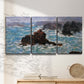 Three-panel canvas wall art featuring storm waves battering rocky coast, displayed in a minimalist living room above a console table.