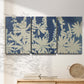 Three-panel canvas wall art featuring delicate lupine floral composition, displayed in a minimalist living room above a console table.