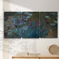 Three-panel canvas wall art featuring water lilies on reflective pond, displayed in a minimalist living room above a console table.