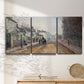 Three-panel canvas wall art featuring tree lined boulevard in town, displayed in a minimalist living room above a console table.