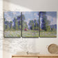 Three-panel canvas wall art featuring poppy field near garden village, displayed in a minimalist living room above a console table.