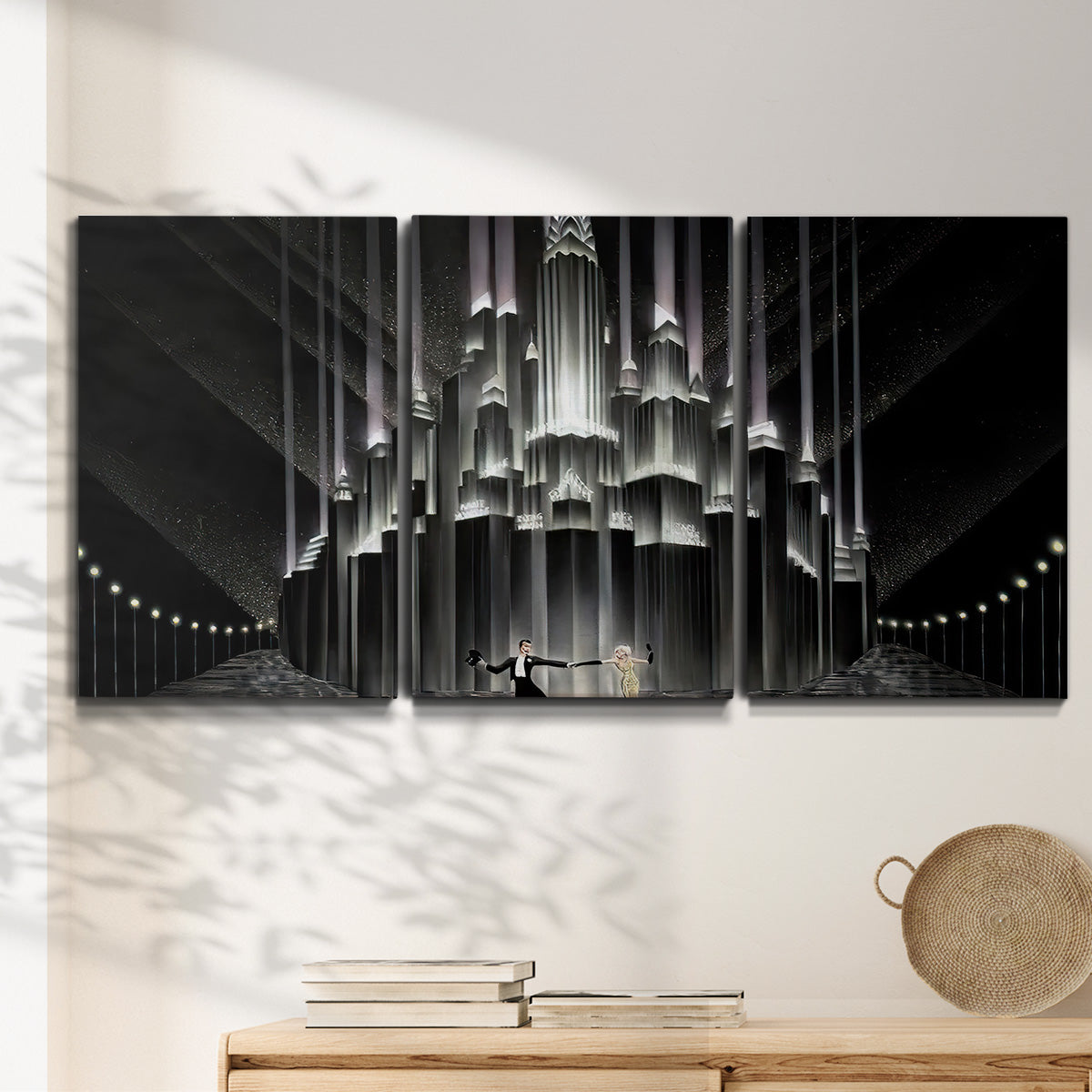Three-panel canvas wall art featuring vintage city scene with figures, displayed in a minimalist living room above a console table.