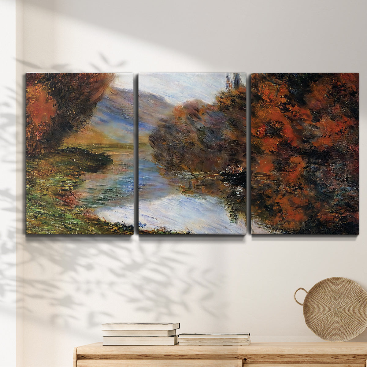 Three-panel canvas wall art featuring rowboat on quiet river bend, displayed in a minimalist living room above a console table.