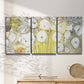 Three-panel canvas wall art featuring vintage inspired floral abstraction, displayed in a minimalist living room above a console table.