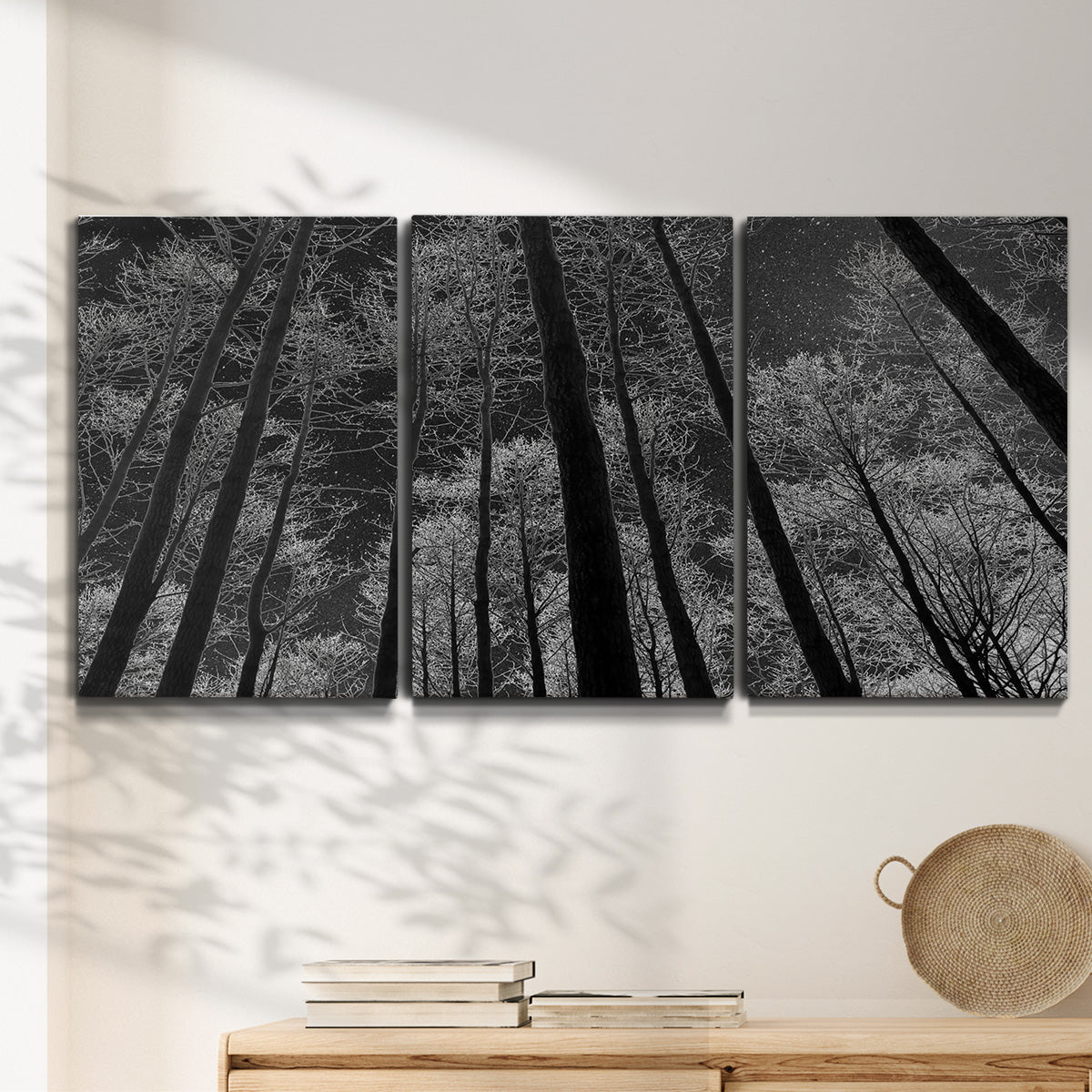 Three-panel canvas wall art featuring riverside houses along canal, displayed in a minimalist living room above a console table.