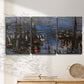 Three-panel canvas wall art featuring Le Havre port at night with lights, displayed in a minimalist living room above a console table.
