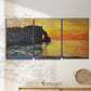 Three-panel canvas wall art featuring arched coastal cliff above sea, displayed in a minimalist living room above a console table.