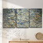 Three-panel canvas wall art featuring abstract water surface reflections, displayed in a minimalist living room above a console table.