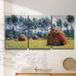 Three-panel canvas wall art featuring harvested grainstacks in field, displayed in a minimalist living room above a console table.