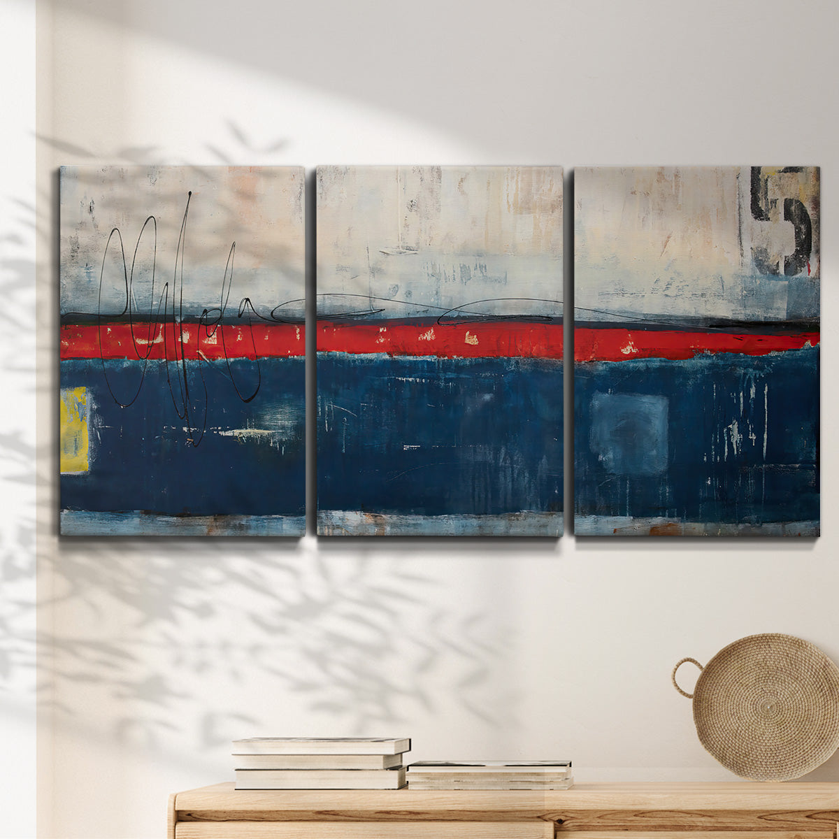 Three-panel canvas wall art featuring weathered coastal dock scene, displayed in a minimalist living room above a console table.