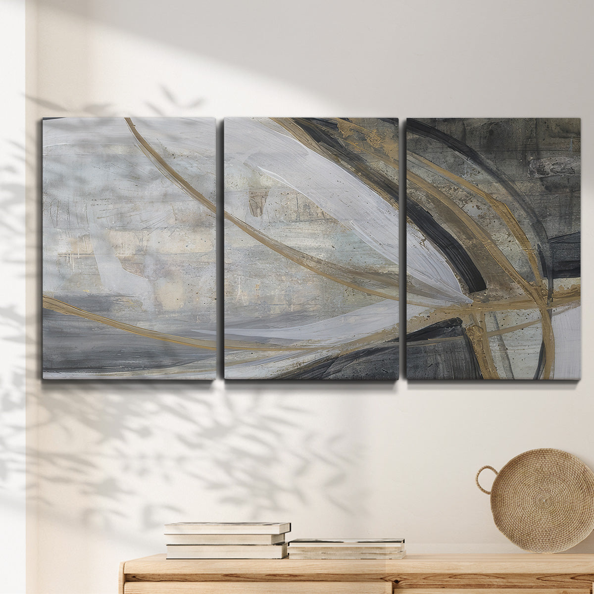 Three-panel canvas wall art featuring spiraling abstract vortex motion, displayed in a minimalist living room above a console table.