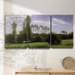 Three-panel canvas wall art featuring open landscape near le havre, displayed in a minimalist living room above a console table.