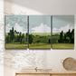 Three-panel canvas wall art featuring lush green summer countryside, displayed in a minimalist living room above a console table.