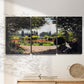 Three-panel canvas wall art featuring coastal garden overlooking sea, displayed in a minimalist living room above a console table.