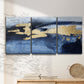 Three-panel canvas wall art featuring coastal shoreline with warm light, displayed in a minimalist living room above a console table.