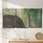 Three-panel canvas wall art featuring layered green abstract composition, displayed in a minimalist living room above a console table.