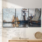 Three-panel canvas wall art featuring fishing boats navigating open water, displayed in a minimalist living room above a console table.