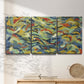 Three-panel canvas wall art featuring colorful abstract river like motion, displayed in a minimalist living room above a console table.