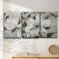 Three-panel canvas wall art featuring soft southern floral charm, displayed in a minimalist living room above a console table.