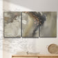 Three-panel canvas wall art featuring flowing abstract wave motion, displayed in a minimalist living room above a console table.