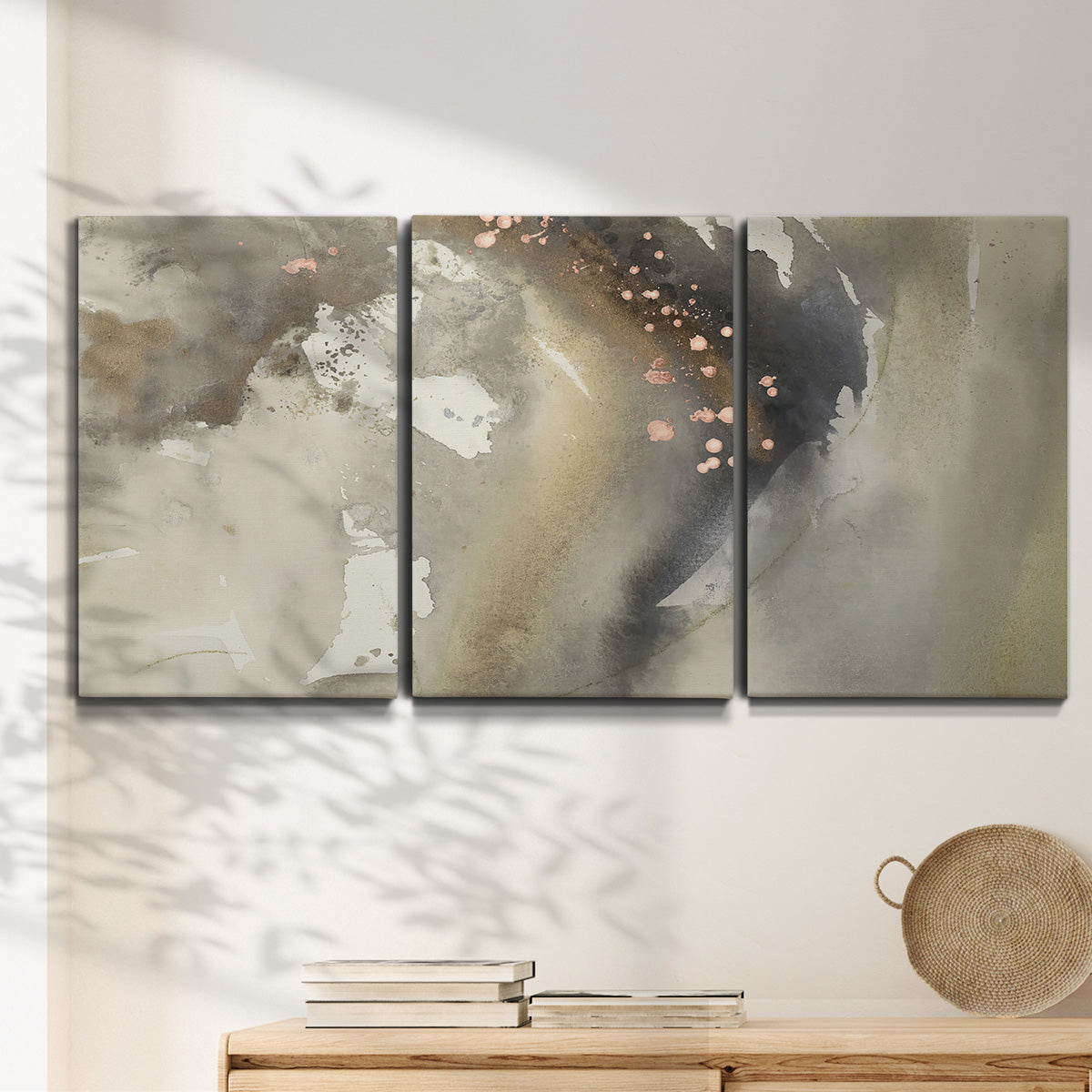 Three-panel canvas wall art featuring flowing abstract wave motion, displayed in a minimalist living room above a console table.