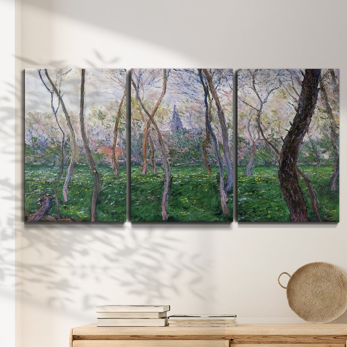 Three-panel canvas wall art featuring spring landscape along river, displayed in a minimalist living room above a console table.