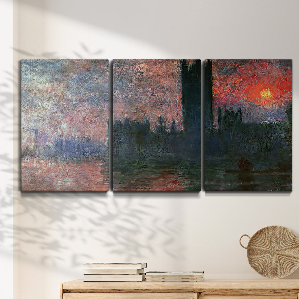 Three-panel canvas wall art featuring parliament silhouetted at dusk, displayed in a minimalist living room above a console table.