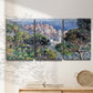 Three-panel canvas wall art featuring coastal hillside overlooking monaco, displayed in a minimalist living room above a console table.