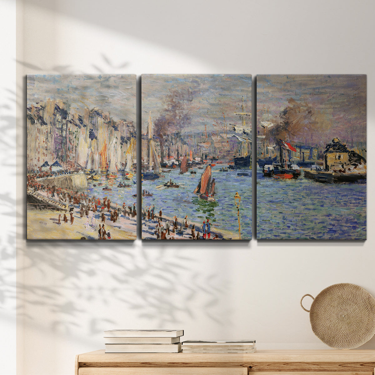 Three-panel canvas wall art featuring evening harbor with reflections, displayed in a minimalist living room above a console table.