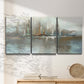 Three-panel canvas wall art featuring glowing abstract city lights, displayed in a minimalist living room above a console table.