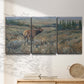 Three-panel canvas wall art featuring western wildlife grazing in open field, displayed in a minimalist living room above a console table.