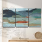 Three-panel canvas wall art featuring vibrant abstract with dramatic motion, displayed in a minimalist living room above a console table.