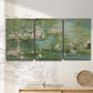 Three-panel canvas wall art featuring soft green water lilies, displayed in a minimalist living room above a console table.