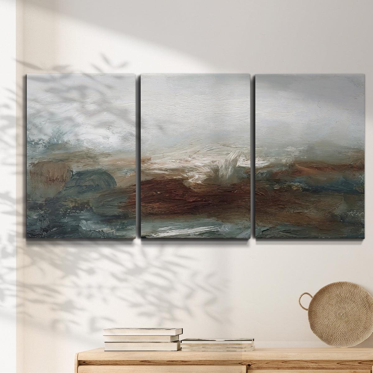 Three-panel canvas wall art featuring soft abstract evening light, displayed in a minimalist living room above a console table.
