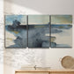 Three-panel canvas wall art featuring abstract watercolor with upward motion, displayed in a minimalist living room above a console table.