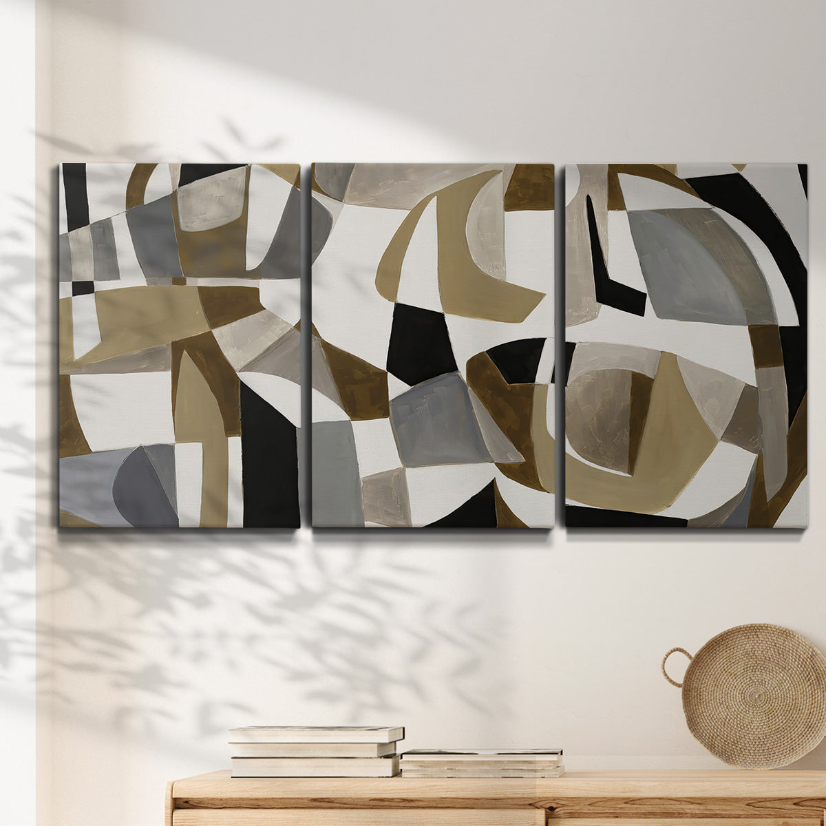 Three-panel canvas wall art featuring overlapping mid century geometric shapes, displayed in a minimalist living room above a console table.