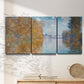 Three-panel canvas wall art featuring autumn landscape with glowing foliage, displayed in a minimalist living room above a console table.
